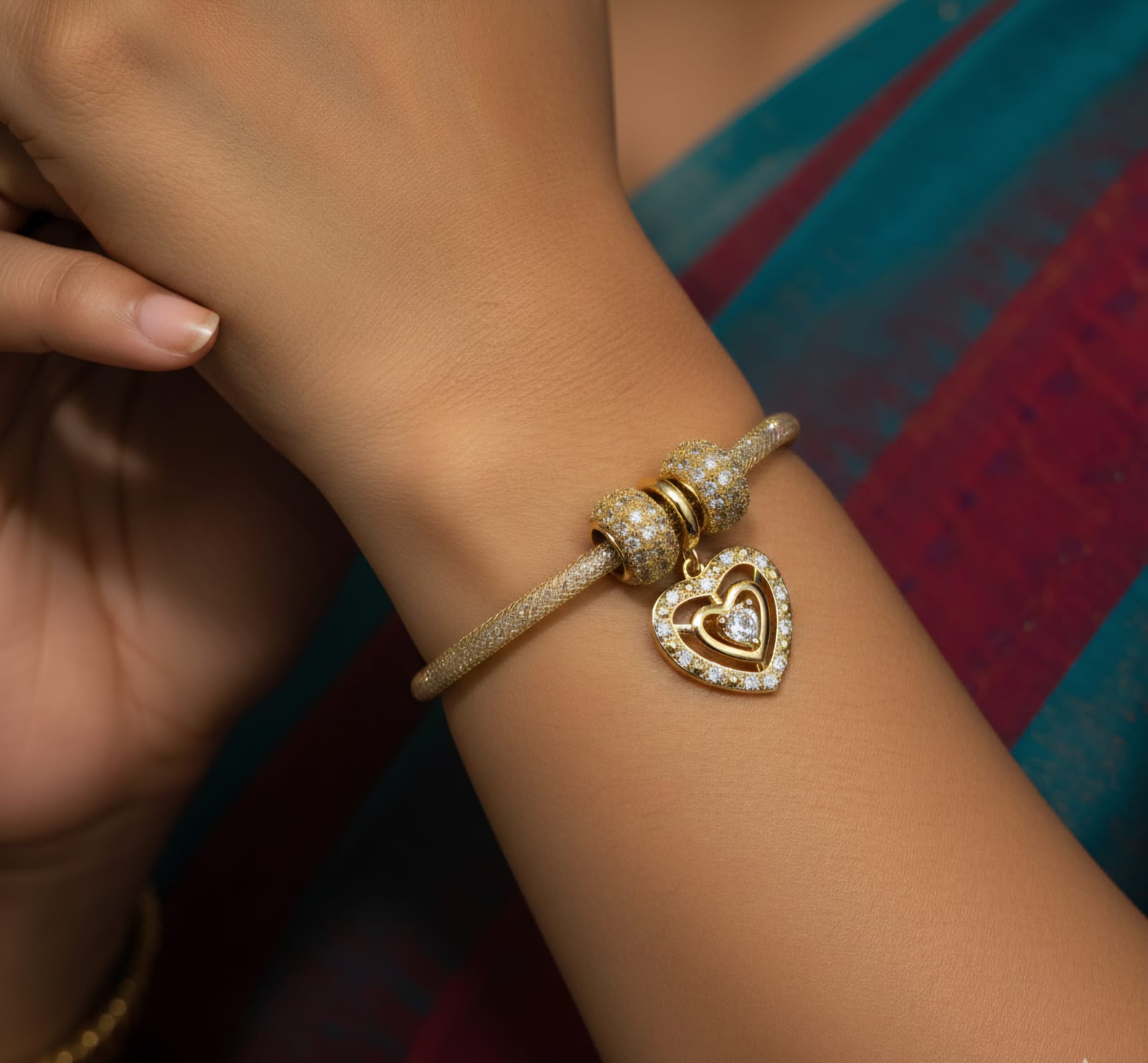 Stylish dual-tone beaded bracelet featuring glossy silver and white pearl beads with tiny golden spacers and a sparkling heart-shaped charm, perfect for partywear and daily fashion